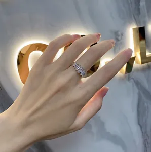 Close-up of a hand wearing a 925 silver ring with marquise-cut sparkling stones