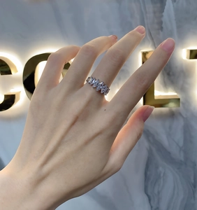 Detail of 925 silver ring featuring five marquise-cut gems worn on a finger