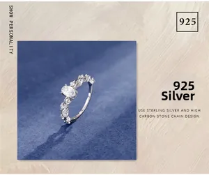 Detail of 925 sterling silver ring with oval cut carbon diamond and chain band
