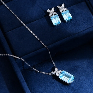 Silver jewelry set with rectangular aquamarine stones and marquise zircon accents