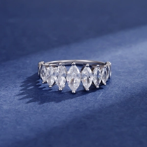 Elegant 925 sterling silver ring featuring seven marquise-cut carbon diamonds on blue background