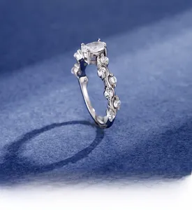 Detailed view of intertwined silver vine band with oval centerpiece and sparkling stones