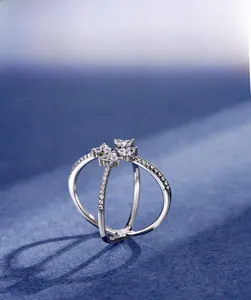 Macro shot of 925 silver four-leaf clover ring with 5A zircon heart crystals