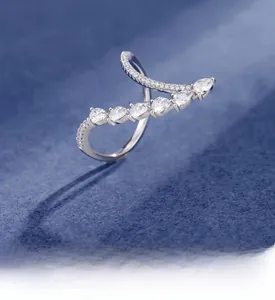 Detailed view of sterling silver wave ring with pear-cut cubic zirconia inlays