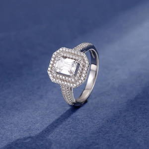 Elegant 925 silver ring featuring a rectangular emerald cut main stone with double halo