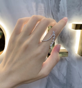 Close-up of a double-layer S925 sterling silver ring with sparkling teardrop zircons