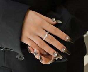 Detail of silver vine band ring with micro-paved zircons and oval center stone