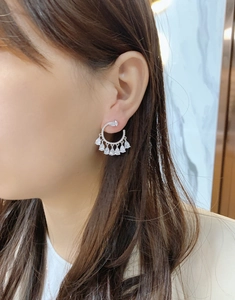Elegant s925 silver C-shape tassel earrings with pear-cut cubic zirconia on a model