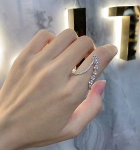 Macro detail of a 925 sterling silver ring with sparkling round and teardrop crystals