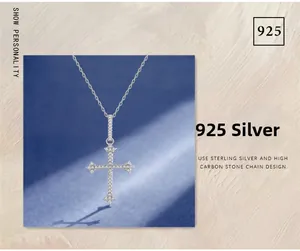 Macro shot of 925 sterling silver cross pendant with sparkling high carbon stones