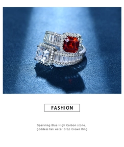 Macro detail of stacked 925 silver rings with red and clear Asscher-cut gemstones