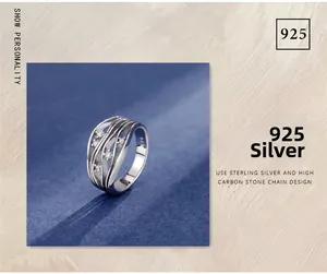 Macro shot of S925 sterling silver ring showing 925 hallmark and wavy layered design
