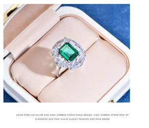Macro view of emerald-cut green stone ring in premium velvet jewelry gift box