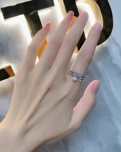 Detailed view of S925 sterling silver triple layer ring with heart and zircon charms