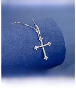 Macro detail of S925 sterling silver cross pendant with micro-pave white zircons