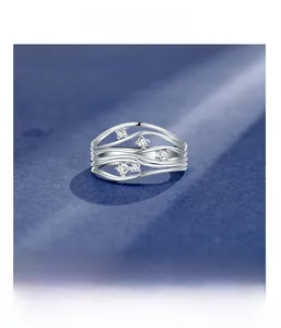 Detailed macro shot of wavy S925 silver ring featuring five micro-paved cubic zirconia stones
