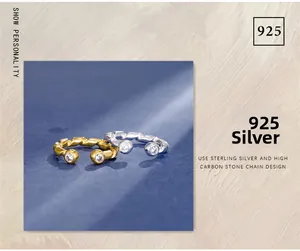 Detailed view of S925 sterling silver twisted chain rings in gold and silver finishes