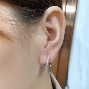 S925 sterling silver double hoop earrings with cubic zirconia on a female model