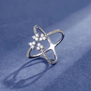 Crisscross S925 silver ring with sparkling zircon stones in a four-prong setting