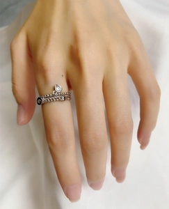 Detailed view of the S925 sterling silver triple-layer chain ring with a zircon heart charm