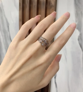 Macro shot of S925 sterling silver wavy layered ring with cubic zirconia on model