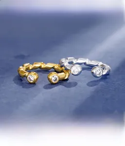 Detailed macro view of S925 sterling silver twist rings with pavé set zircon stones