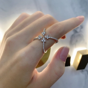 Crossed four-petal sterling silver ring with pavé-set zircon for a luxury fashion look