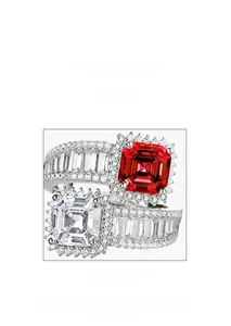 Detail view of square red and white gemstones with micro-pave setting on silver rings