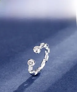Macro detail of S925 sterling silver twist ring featuring two sparkling 5A cubic zirconia