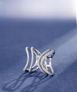Macro shot of 925 sterling silver ring featuring layered wave patterns and 5A zircon stones