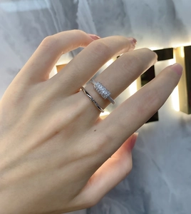 Close-up of double-layered silver ring with micro-pave cubic zirconia on a model hand