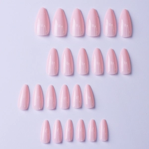 Set of glossy pink almond-shaped press-on nails displayed on a lavender background