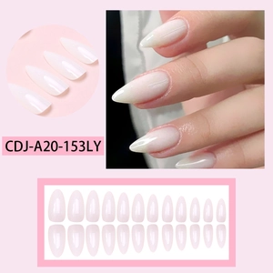 Close-up detail of glossy almond-shaped press-on nails in elegant milky white finish