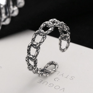 Vintage Thai silver twisted chain ring with distressed finish on a Vogue fashion card