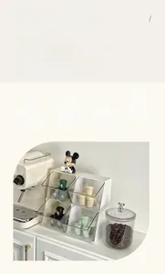 Airtight glass storage jar with silver bear lid filled with coffee beans in a kitchen