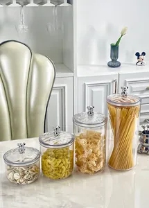 Set of four clear airtight food storage jars with silver bear lid handle and dry ingredients