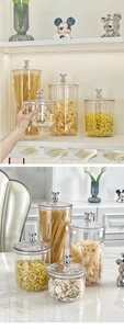 Detail view of transparent storage jars with silver bear lid knobs and sealing rings