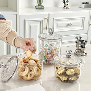 Transparent food storage jars with silver bear handles for kitchen pantry organization