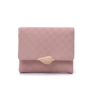 Detailed macro view of pink PU leather wallet texture with gold leaf metal buckle
