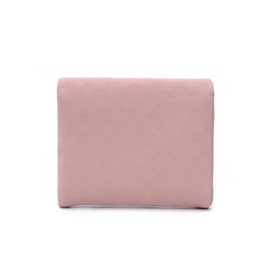 Detail of light pink PU leather wallet with textured finish and leaf-shaped buckle closure