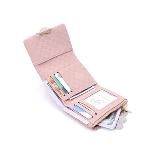 Interior detail of pink trifold wallet showing multiple card slots and leaf metal buckle