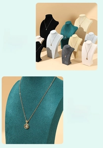 Close-up of premium velvet texture on multiple colored necklace display busts