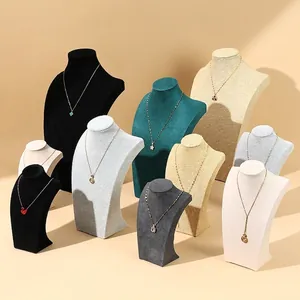 Minimalist necklace display bust stands in various velvet and linen finishes for jewelry