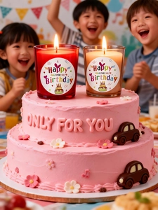 Close-up of Happy Birthday glass candles with colorful cake at a kids birthday party
