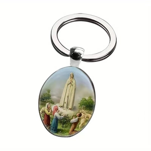 Macro shot of silver metal keyring with a polished oval Fatima religious icon charm