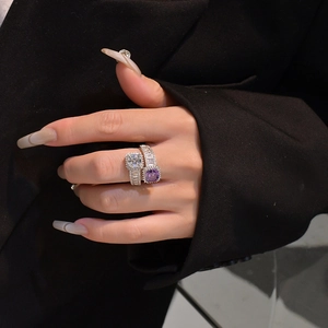 Detailed shot of double square stone silver ring with clear and purple gems on model
