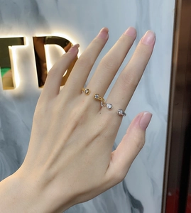 Close-up of minimalist S925 sterling silver twist rings with sparkling zircon crystals