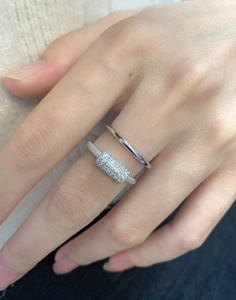 Macro shot of double-layered sterling silver rings with micro-pave rectangular zirconia setting