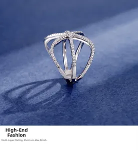 Close-up of multilayered crisscross silver ring with cubic zirconia and platinum plating