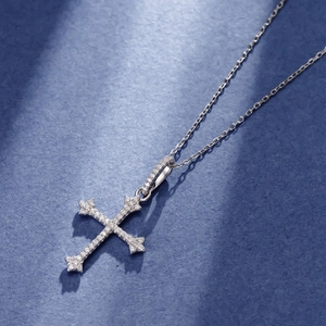 Micro shot of a 925 sterling silver cross necklace with sparkling cubic zirconia pavé